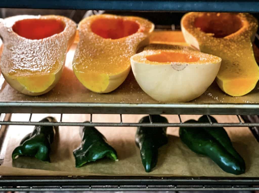 roasting two cut butternuts and poblano peppers at the same time