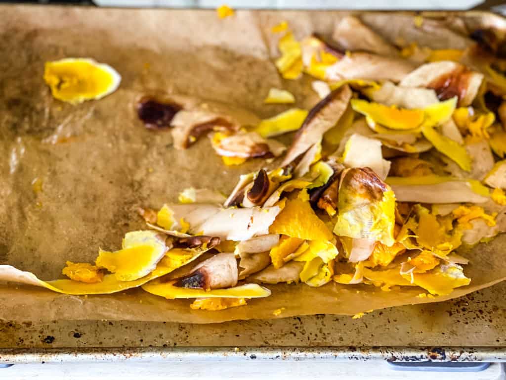 butternut squash peels on parchment paper for easy cleanup