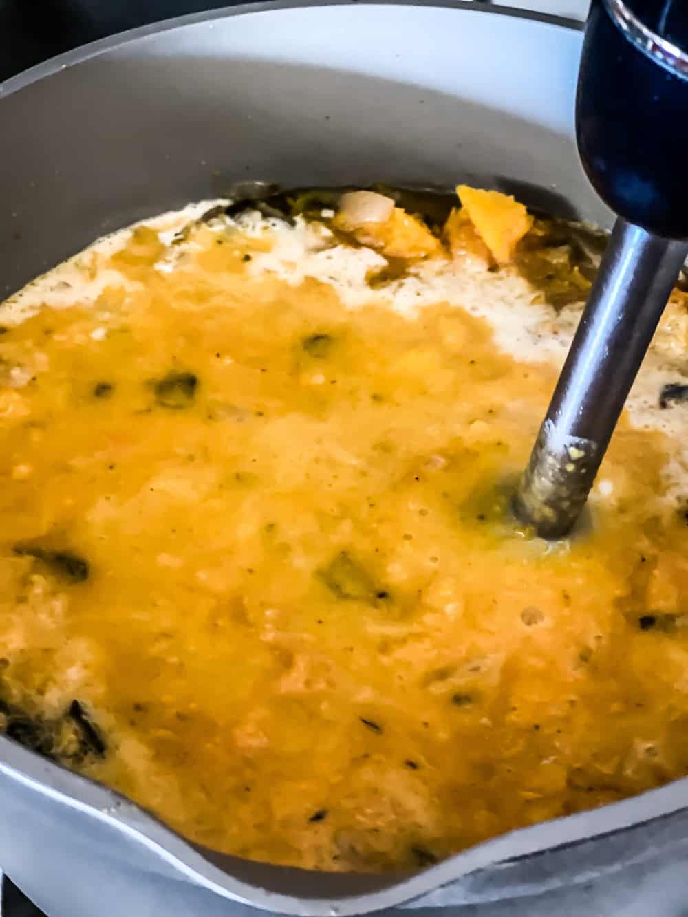 blending butternut squash soup with immersion blender