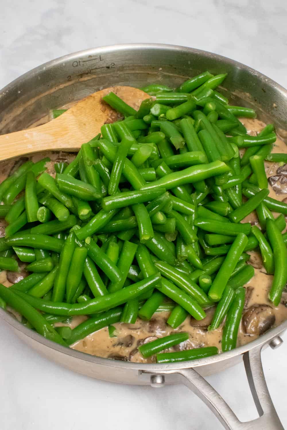 stirring in the green beans