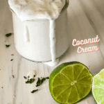 jar of coconut lim crema with cut limes in the foreground and pinterest text overlay