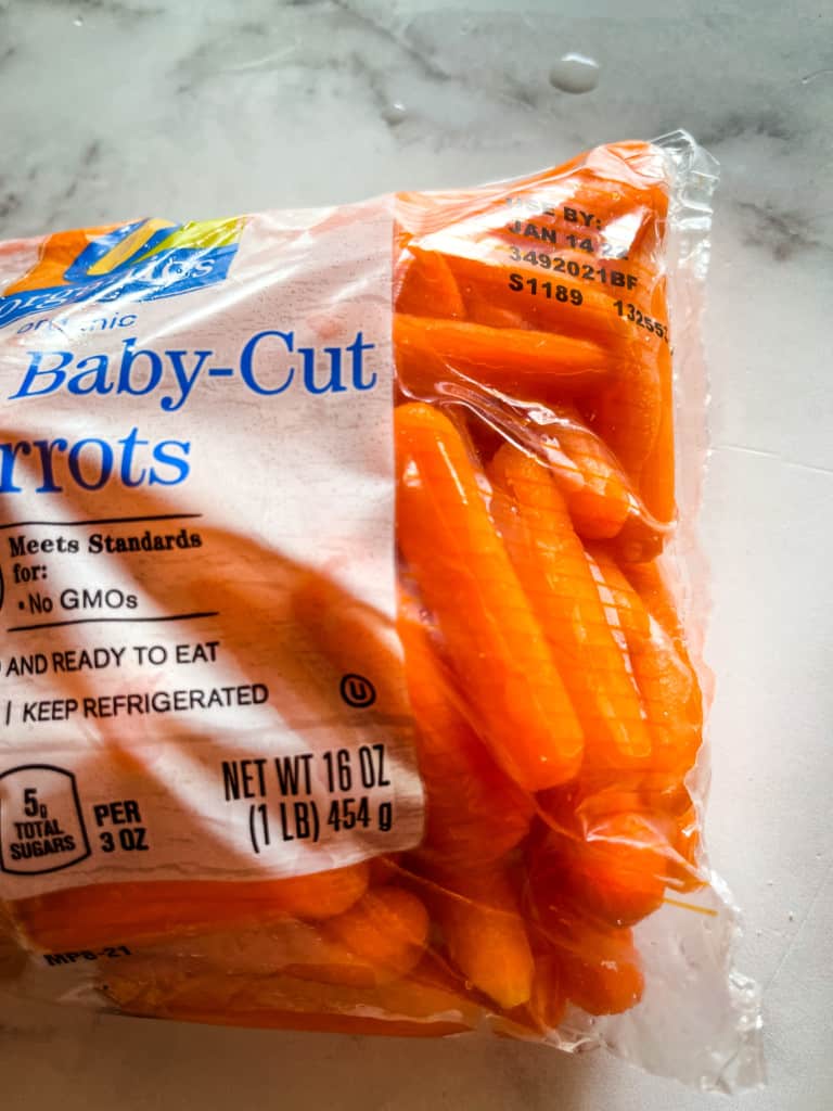 bag of baby carrots showing moisture inside