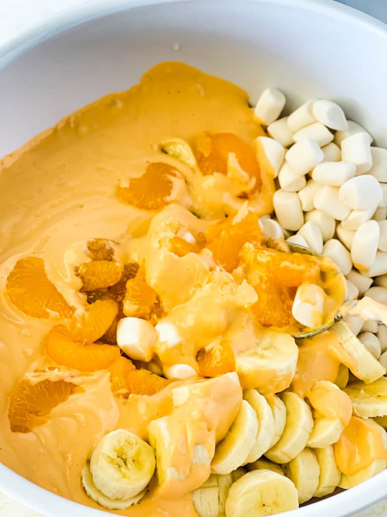 mixing ingredients for vegan orange fluff salad