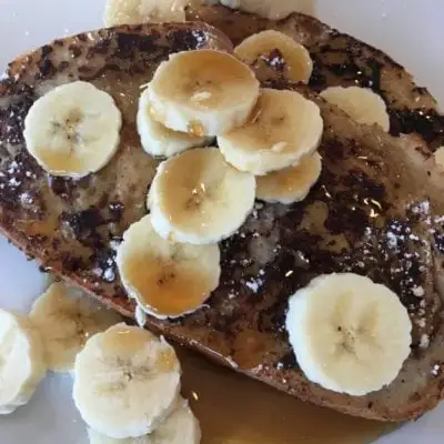 french toast with sliced bananas on top