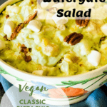 vegan watergate salad in flowered bowl with pinterest text overlay