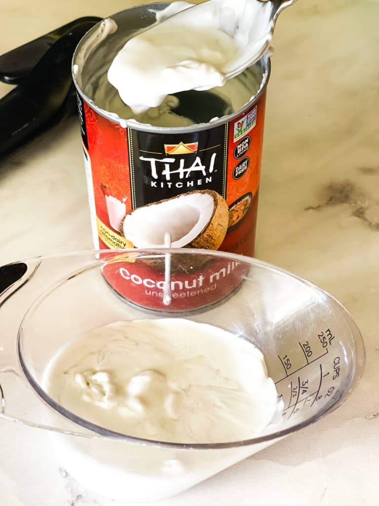removing the coconut cream for a can of coconut milk
