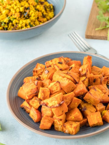 air fryer sweet potatoes in bowl with tofu scramble in background