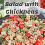 prepared quinoa salad with chickpeas on a dark slate plate with Pinterest text overlay