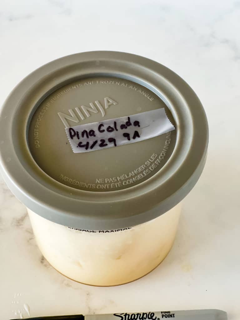 labeling the lid of pina colada ninja ice cream