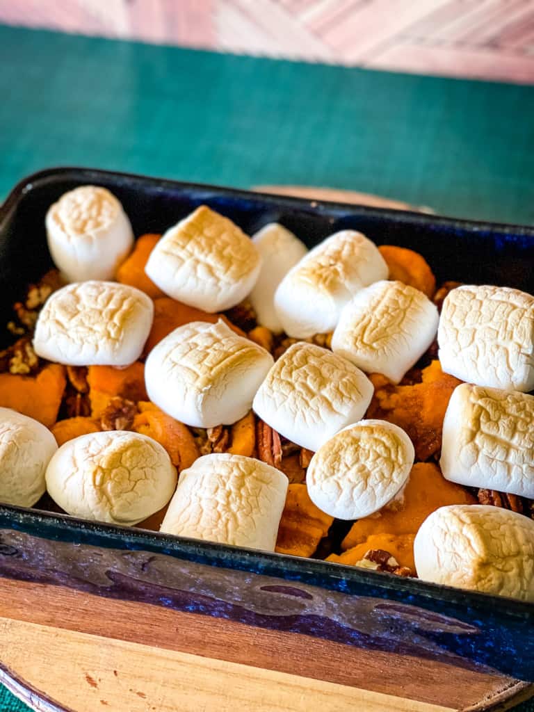 cooked canned yams casserole showing toasted marshmallows