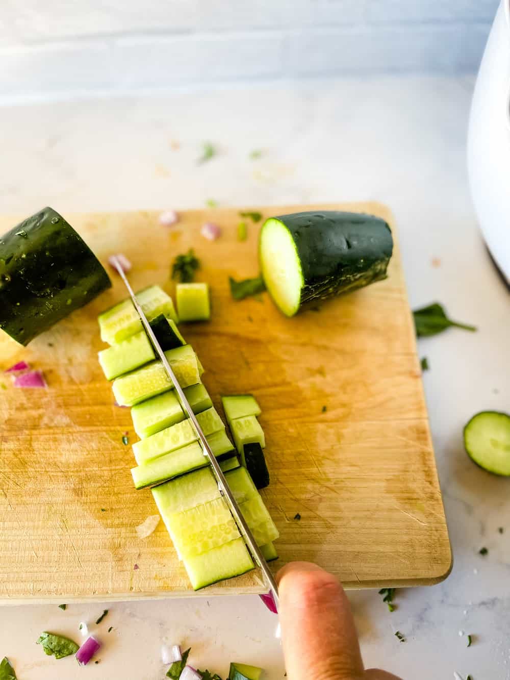 chopping the cucumber
