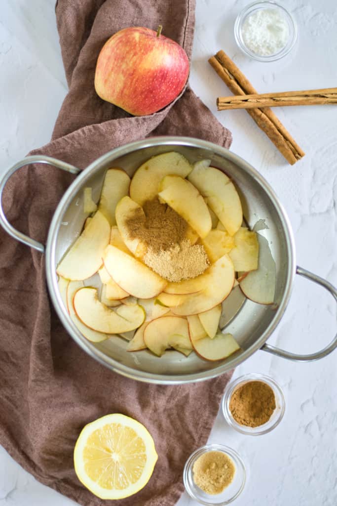 cut apples in pot with brown sugar and cinnamon