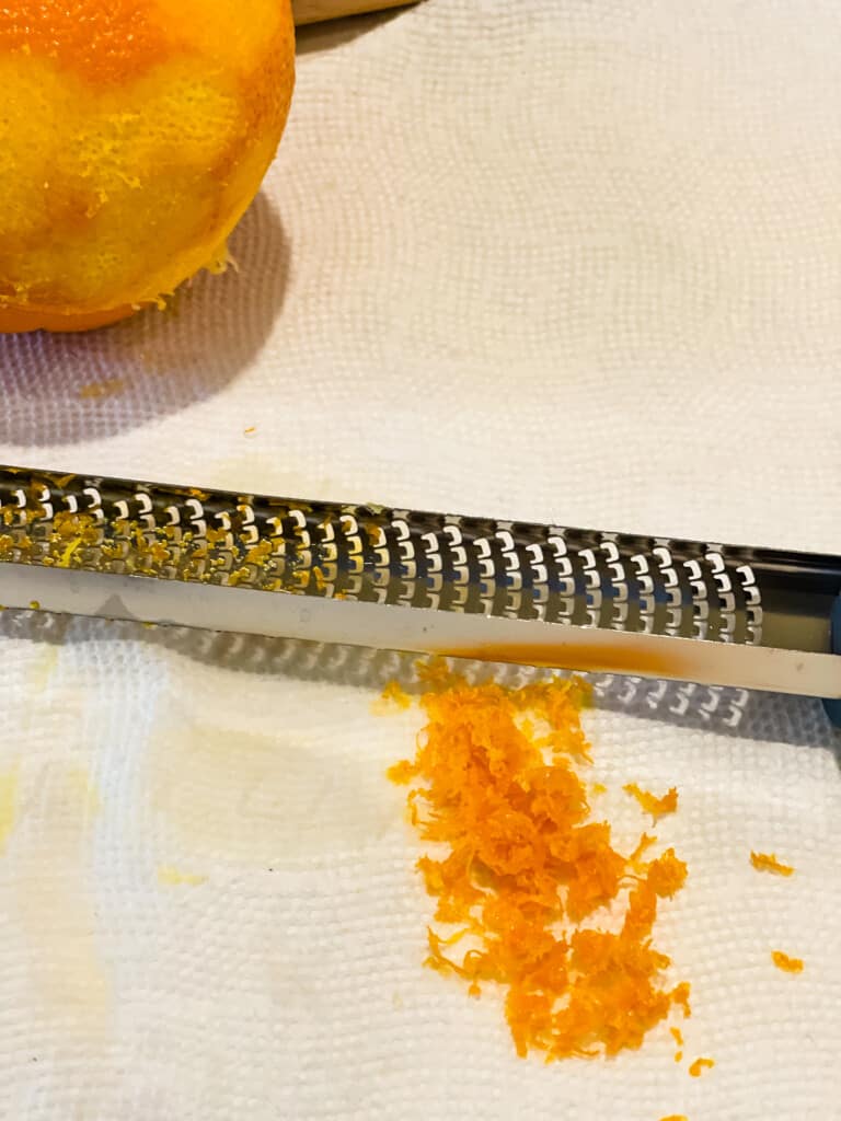 zesting the oranges with a planer