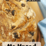a loaf of cinnamon raisin no-knead bread with pinterest text overlay