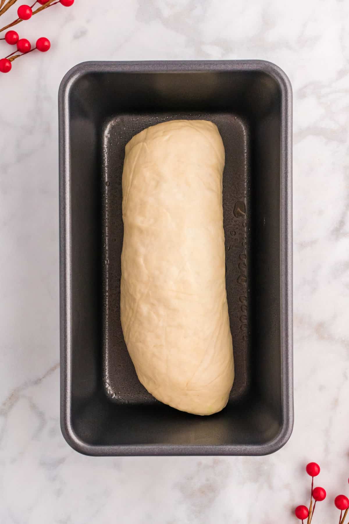 the prepared rolled dough in a loaf in the prepared pan