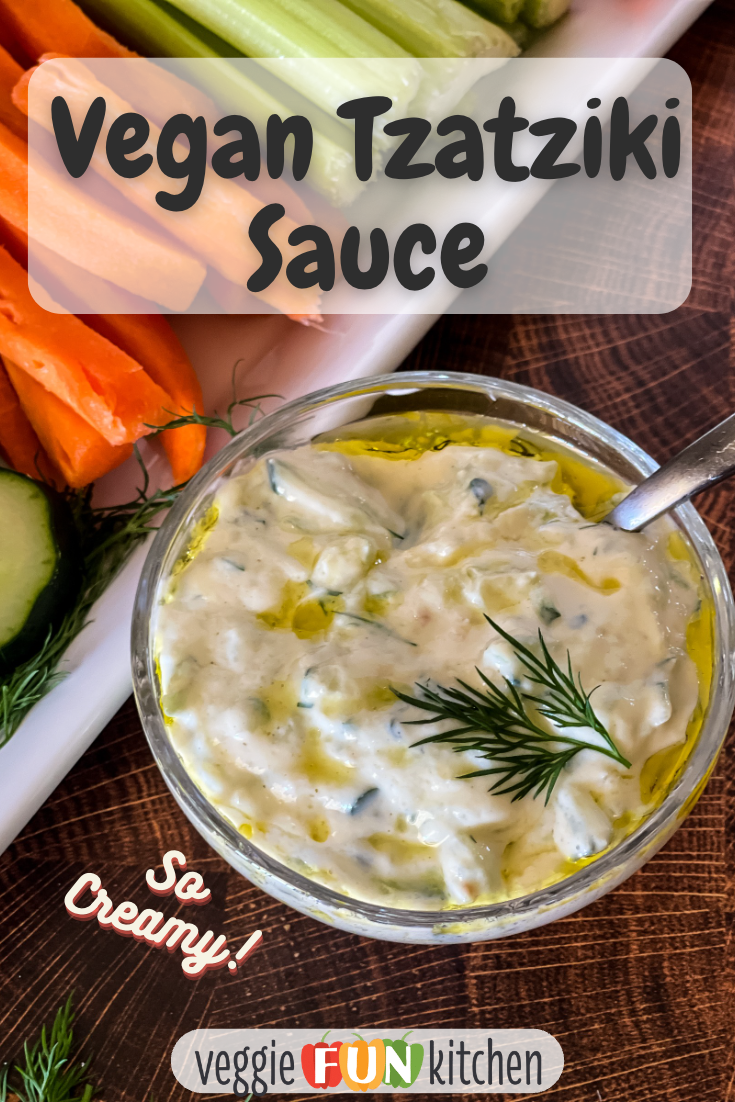 small bowl of vegan tzatziki sauce with plate of carrots, celery, and other veggies in background with pinterest text overlay