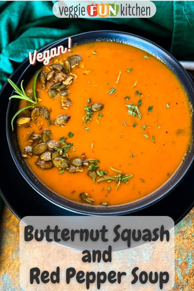 bowl of butternut squash red pepper soup with pepitas and rosemary garnish with pinterest text overlay