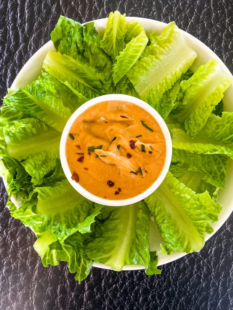 peanut sauce with lettuce with pieces from the end of romaine lettuce