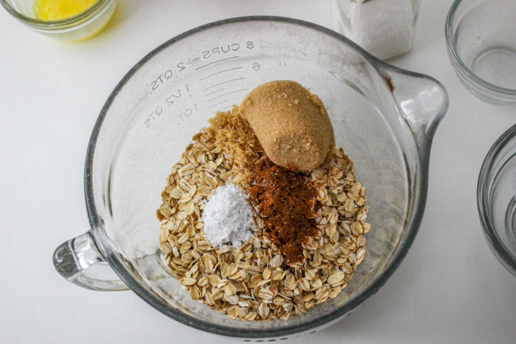 Ingredients for the oat mixture including oats, brown sugar, cinnamon, and baking powder.