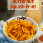 A white bowl of butternut squash fries with a butternut squash in the background. With pinterest text overlay.