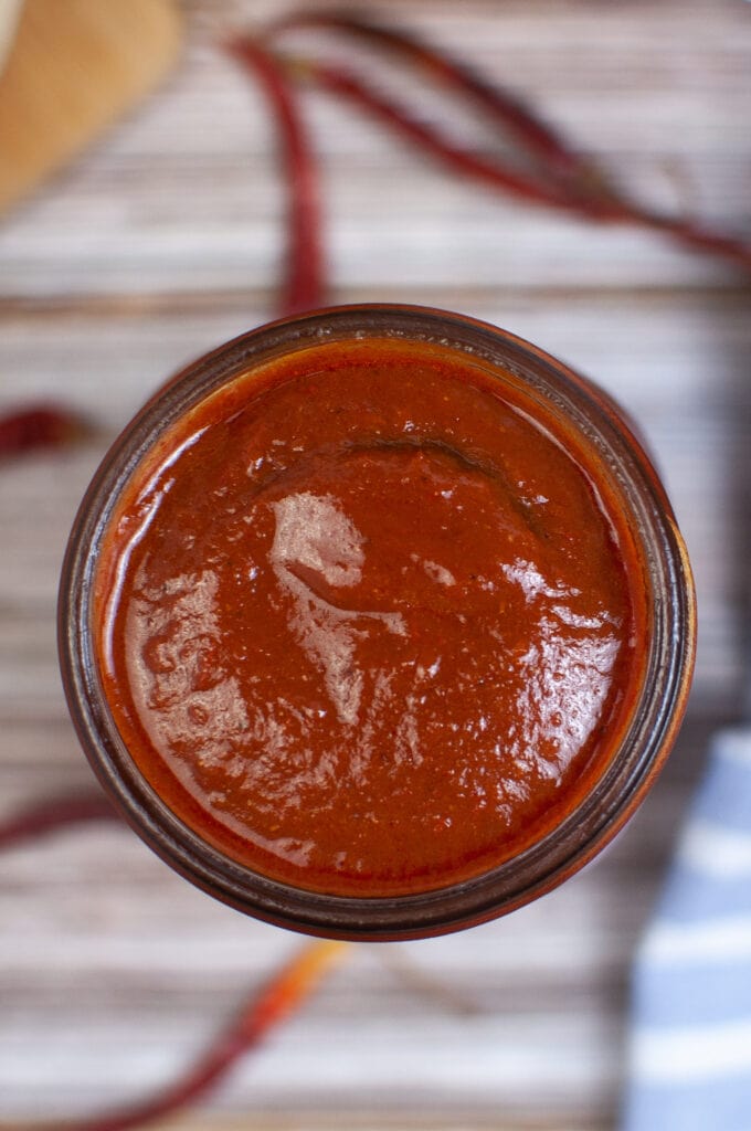 Looking down on a jar of enchilada sauce.
