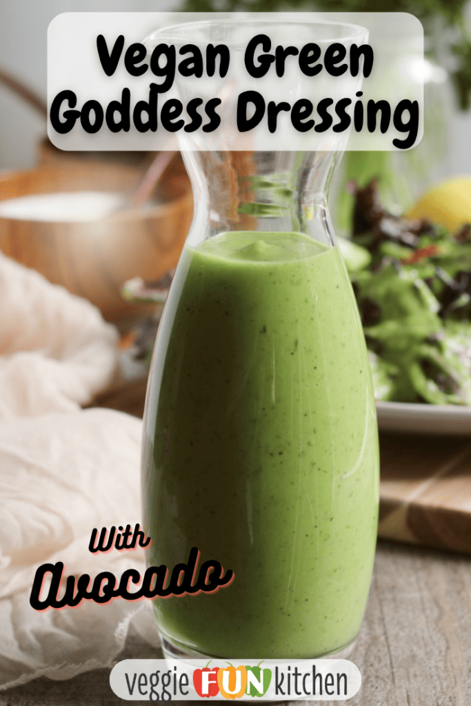Jar of green goddess dressing in the front with a salad in the background. With pinterest text overlay.