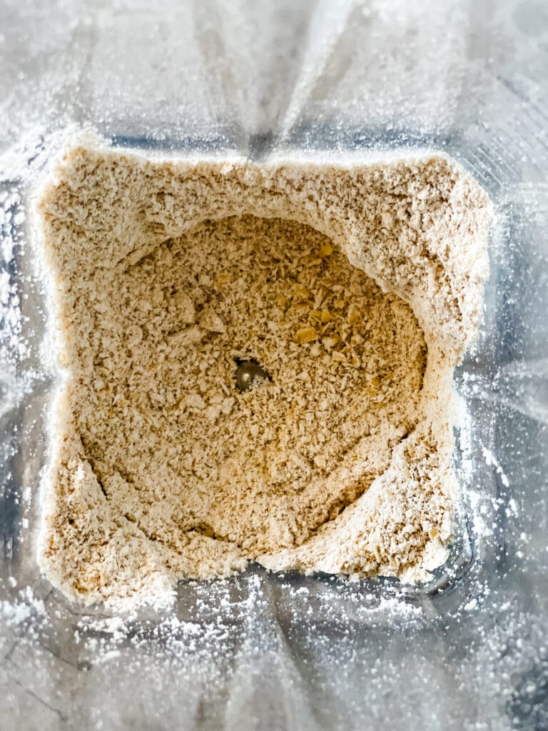 Making oat flour from old fashioned oats in a blender.