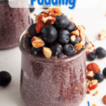 Two small glass jars with blueberry chia pudding and a mix of blueberries and chopped almonds on top with a scattering of chopped almonds and blueberries surrounding. WIth Pinterest text overlay.