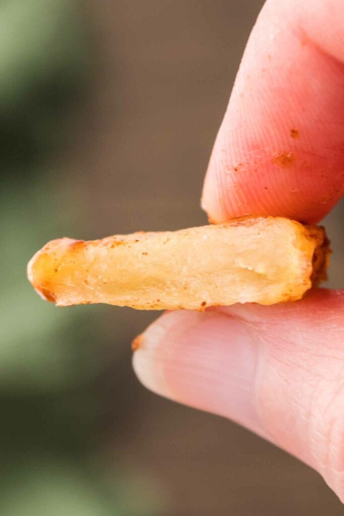 Showing the tender inside of the air fried apple slice.