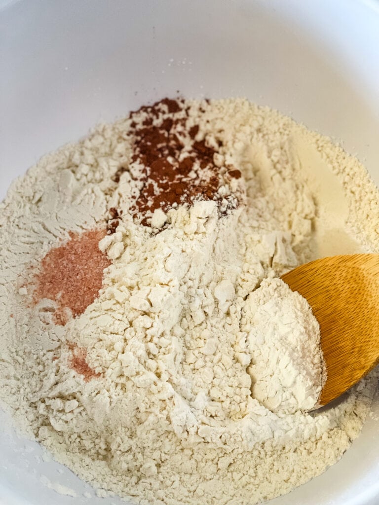 Mixing together the dry ingredients.
