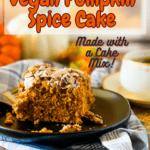 A slice of vegan pumpkin cake on a black plate with a cup of coffee, pumpkins, and a gray checked cloth in the foreground and background. With Pinterest text overlay.