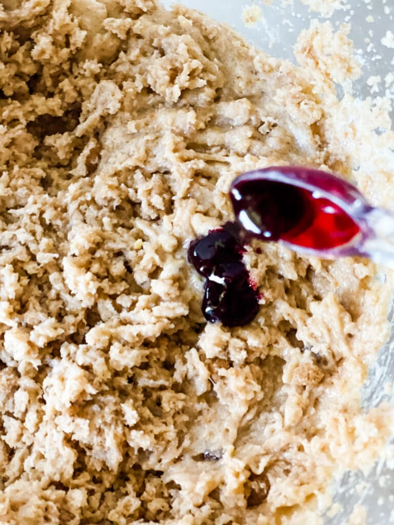 Adding the red food coloring.