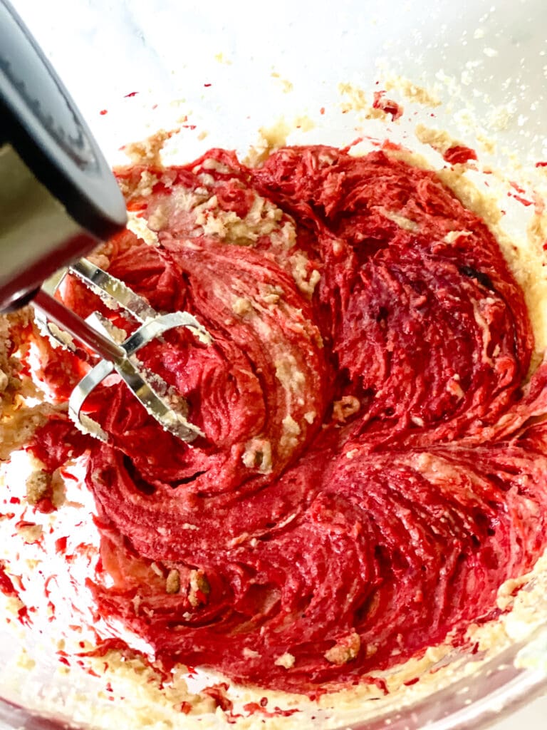 Mixing in the red food coloring.
