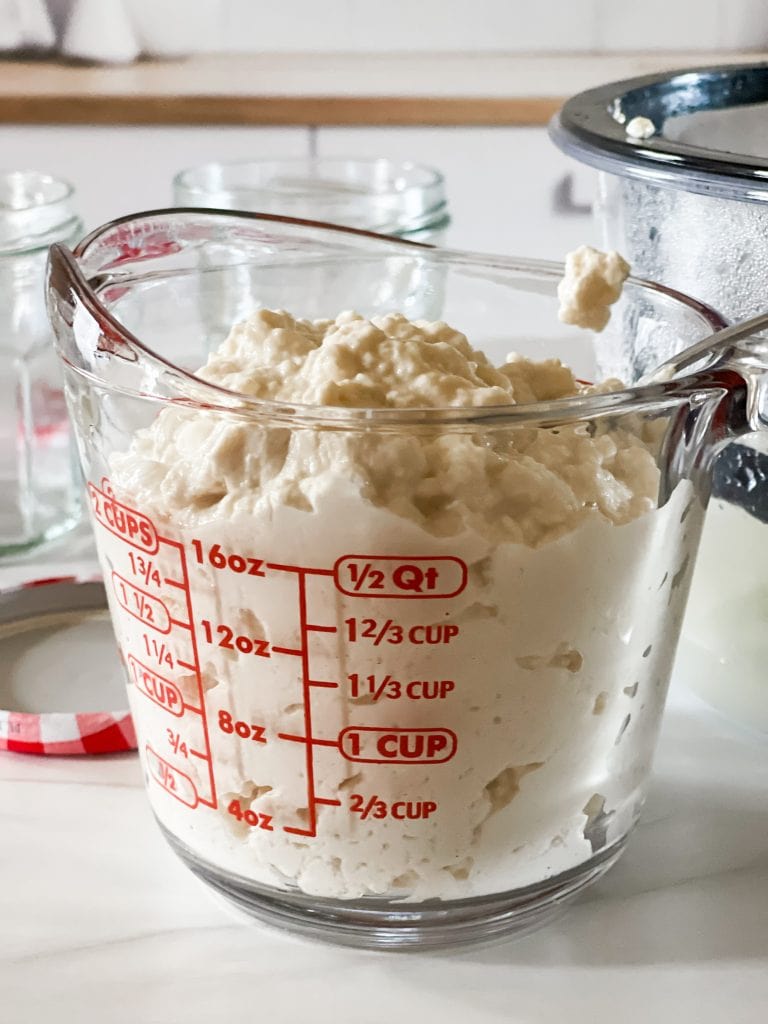 Showing that there is a little more than two cups of strained yogurt left, making it into Greek yogurt.