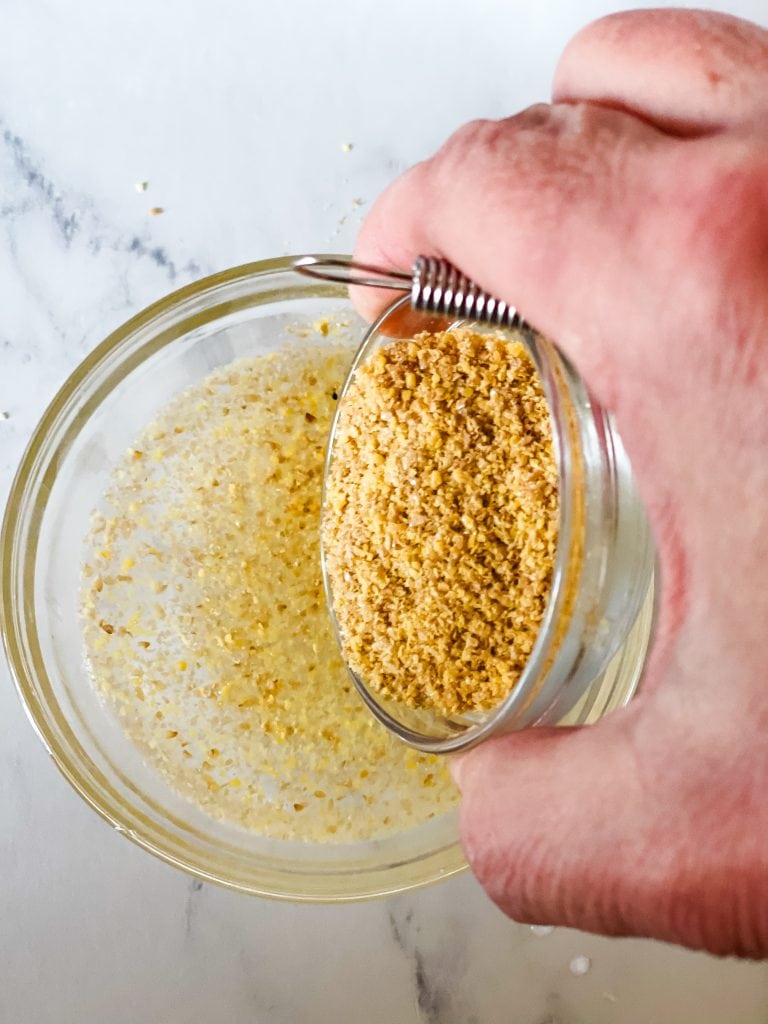 Adding the ground flax to the water.