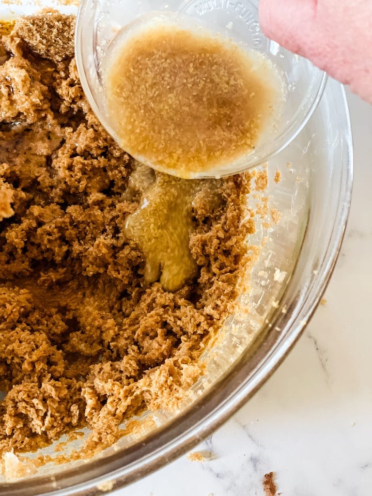 Adding the flax egg to the mixed fat and sugar.