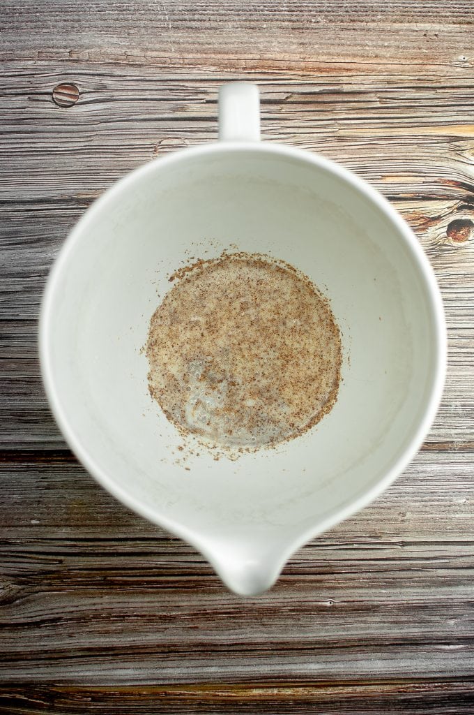 Adding the flaxseed to the plant milk and vinegar.