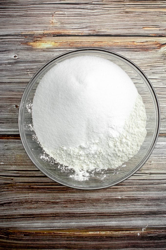 The dry ingredients are in a large glass bowl.