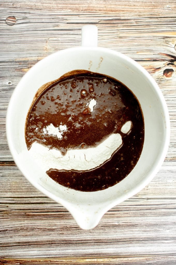 The hot cocoa/fat/vegan buttermilk mixture has been poured on top of the dry ingredients.