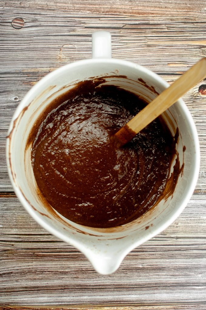 Stirring together to make sure the mixture is smooth.