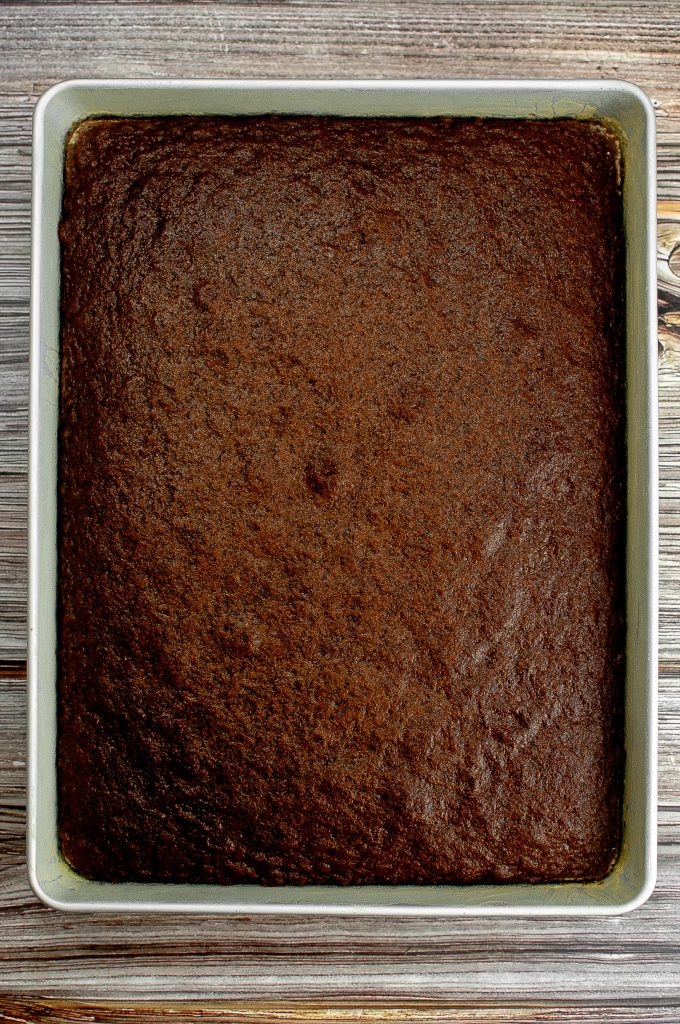 The cake is baked but not yet frosted.