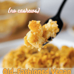 bakeed mac and cheese on a plate with a forkful in the air with Pinterest text overlay