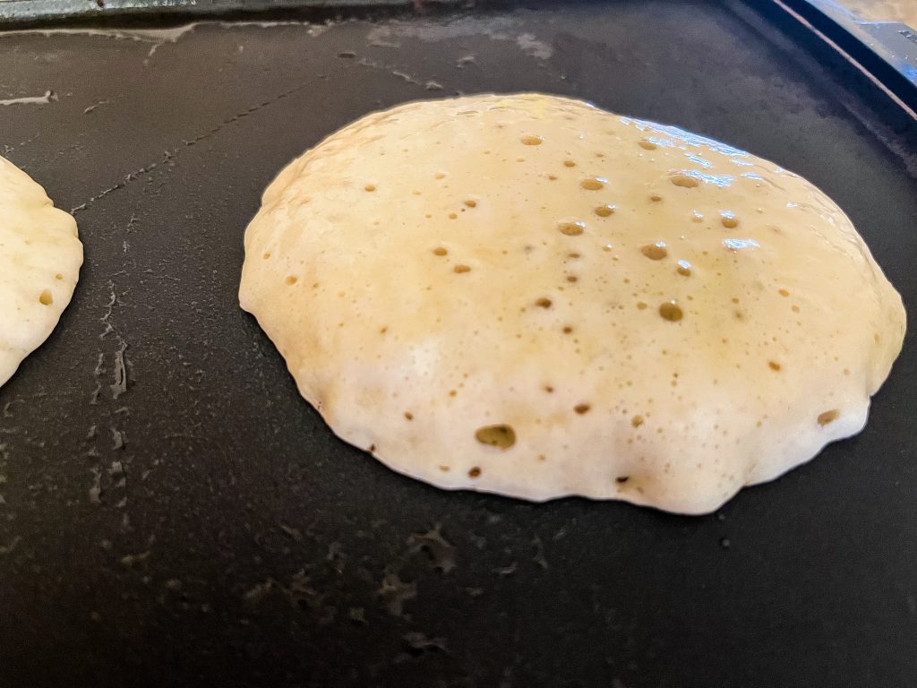 This pancake is ready to turn. You a see the bubbles on the top a the edges are dry.