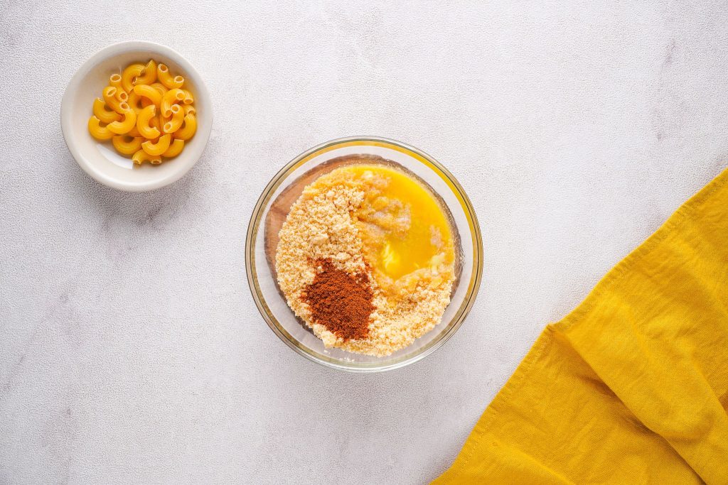 ritz crackers, melted vegan butter and paprika