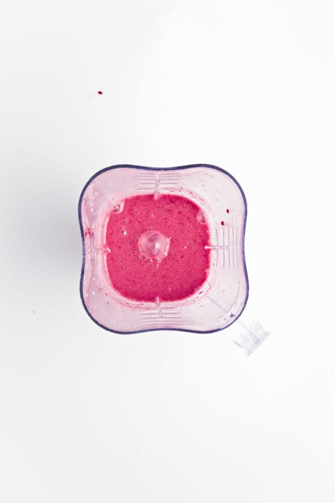 raspberries and oat milk mixture blended