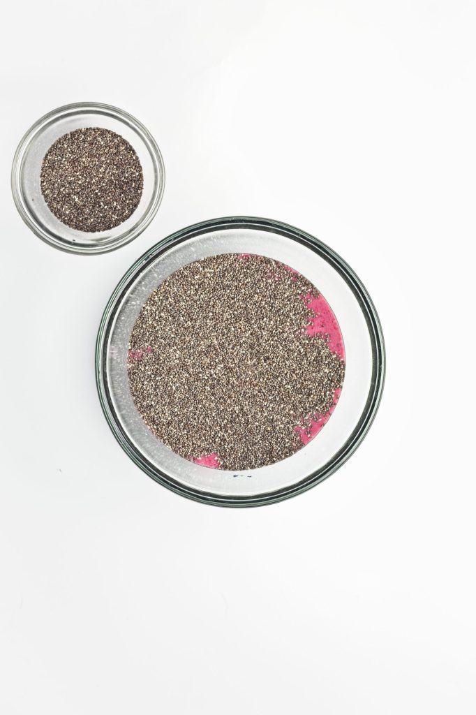 mixing chia seeds into the raspberry mixture
