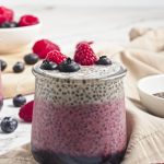 Fresh berry chia pudding topped with raspberries and blueberries. Ideal healthy vegan snack from Veggie Funk Kitchen.
