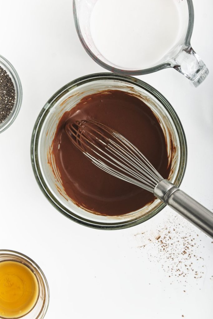 Stirring the ingredients for chocolate chia seed pudding - the chia seeds have not yet been added