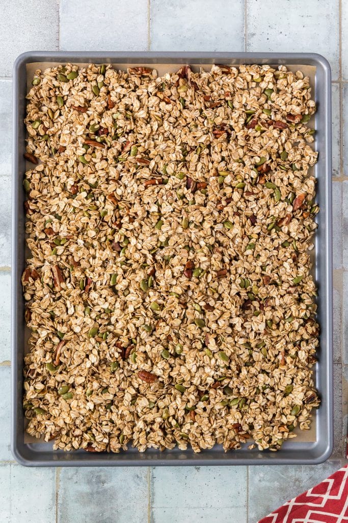 granola in the pan waiting for the chocolate chips to be mixed in