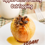 A baked apple with a crunchy oat topping, drizzled with syrup, sits on a white plate. The text reads: Cozy Air Fryer Baked Apples with Crunchy Oat Topping. VEGAN! The background is softly blurred.